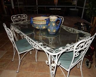 Vintage white wrought iron glass top table with four chairs