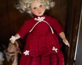 Lots of dolls with crocheted dresses!