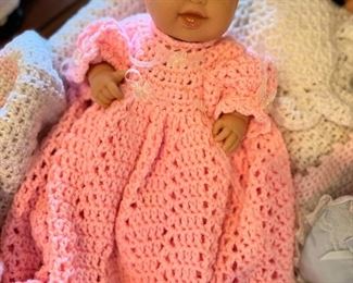 Crocheted dresses on lots of beautiful dolls