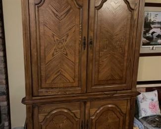 Very nice quality media cabinet with slide-in doors. $250.