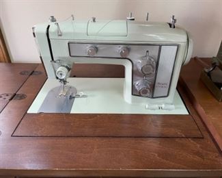 Sears Kenmore sewing machine and table - very complete