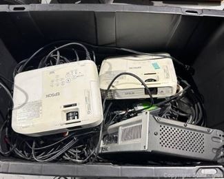 Bin Full of AV Equipment Includes 2 EPSON Projectors 1 QSC Amplifier Misc Strobe Lights and AV Chords