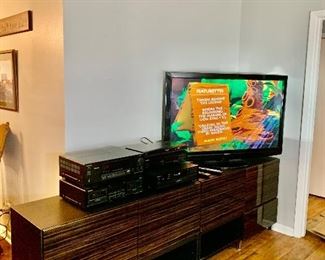 This amazing entertainment center is 8 feet long, 29'tall, and 20" deep.  It has 4 large, closed compartments, 2 drawers, and 2 open compartments. The next picture will show you what it looks like open.