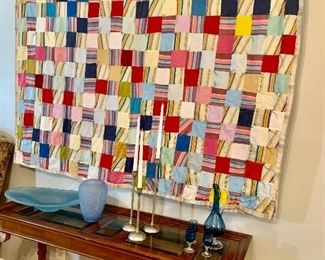 Hanging over the 54"sofa table is a great patchwork quilt piece which looks great as a piece of art but would also look great on your bed or couch.
