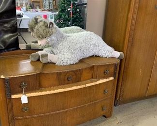 The antique dresser needs a little repair work on its veneer, but it is very sturdy. the attached beveled mirror is amazing.