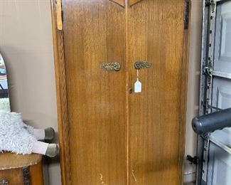 The antique armoire is small in size but full of charm.  It has a piece of trim that needs to be glued back on.  We have the needed pieces.