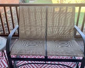 This is a great loveseat glider that looks like it just came out of the box yesterday. Check out the outdoor rug!!!!