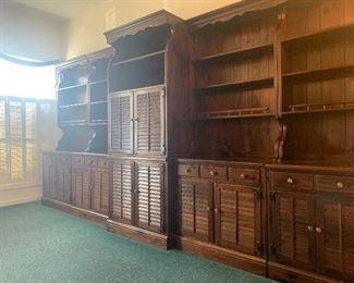 35-30  $1900  Ethan Allen Pine Wall Unit, 5 sections spanning 12’8” - there are 4 sections 32”w  with 18d cabinet and 9d hutch/bookcase/shelf.   One section is 24”w with 18d cabinet and 9d hutch/bookcase/shelf.   The center section is 18.5”d and has a pull out section behind the top cabinet that swivels for up to a 32” tv and video components.  It has vinyl record storage below.  Each section is in 2 pieces with shelves on top and cabinets with shelf on bottom.   Beautiful cabinets.  