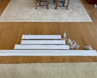 Four white accordion blinds.  36 1/2 39, 45 3/4 and 77 inches