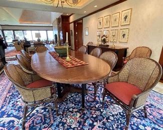 Oval Dining Room Table and 12 Chairs (matches Buffet in previous photos). Table is 88", Custom made leaf is 24". Sides and backs of the chairs are double caned. Brass plaque reads "McGuire Furniture". Condition is excellent.