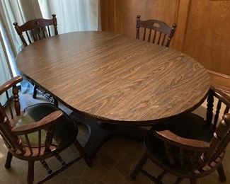 Wood Dining Table with 4 Chairs and 2 Leafs. L 64" x W 42".