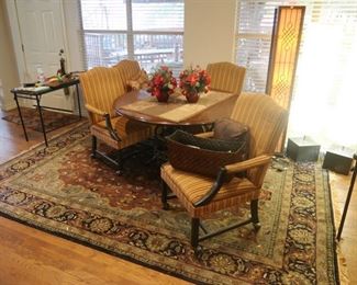 Gorgeous game room table and chairs. Beautiful rugs throughout the home.