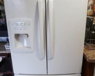 Amana side-by-side refrigerator with freezer on the bottom.