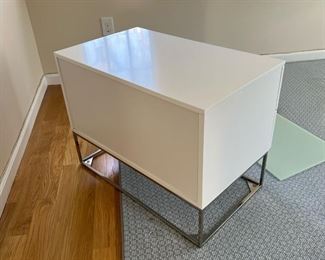SMALL WHITE CREDENZA  |  Modern style side table of small size, having two drawers with chrome hardware and a lower shelf with glass floor plate - l. 30 x w. 18 x h. 22 in.