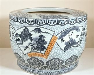 CHINESE CERAMIC PLANTER  |  Blue and white large Chinese porcelain planter with various scenes in reserves and mountainous motifs with rust accents - h. 13 x dia. 18 in.