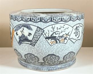 CHINESE CERAMIC PLANTER  |  Blue and white large Chinese porcelain planter with various scenes in reserves and mountainous motifs with rust accents - h. 13 x dia. 18 in.