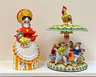 (2pc) RUSSIAN CERAMICS  |  Colorful ceramics, including a female figure with Russian label and a group of children on a merry-go-round (signed and dated 1995) - h. 9 in. (female figure)