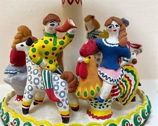 (2pc) RUSSIAN CERAMICS  |  Colorful ceramics, including a female figure with Russian label and a group of children on a merry-go-round (signed and dated 1995) - h. 9 in. (female figure)