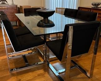 Milo Baughman for Thayer-Coggin, glass and chrome dining table and six chrome and black wool felt chairs—they can be purchased separately
