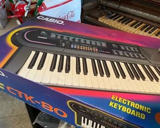 Casio Electronic Keyboard in box with stand and stool