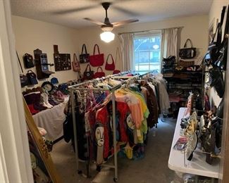 Here is the cothes room which includes shoes, boots, and purses. Most of these still have the original price tags!