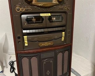 Here it is before the legs were installed. TEAC NOSTALGIA GF -680 STEREO/PHONOGRAPH SYSTEM- DESIGNED TO LOOK LIKE AN OLD FASHIONED RADIO - HAS RADIO - 2 CASSETTE PLAYERS - 3 DISK CD PLAYER WITH 20 RANDOM SELECTION PROGRAMMABLE MEMORY - TOP LIFTS FOR PHONOGRAPH 