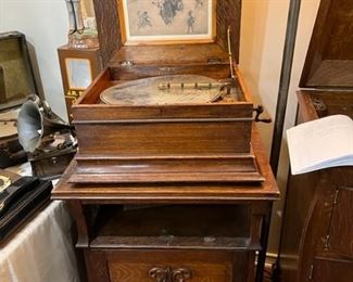 Antique Regina Music Box 1890, with oak cabinet for disk storage.
