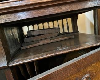 Detail pieces of the Regina storage cabinet.  This cabinet needs some repair.