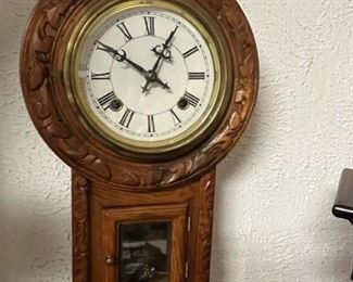 Antique carved wall mounted clock