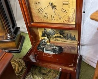 Wonderful cherry cased musical clock with disks and storage