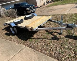 It comes with two sets of tires. The original pair were only rated to be pulled at 55 MPH. The tires on the ground are rated at 80 MPH.