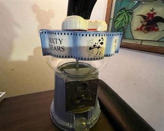 He's standing on a gumball machine