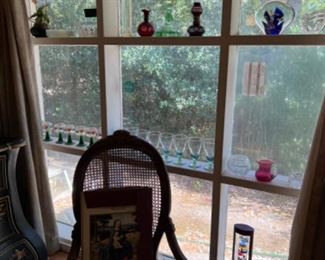 Old rocker, pretty bohemian glass, antique lantern, Galileo thermometers, stemware 