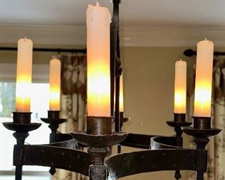 Hand forged Chandelier, made and purchased in France 1950's with glass shades on the bulbs