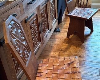 This dining set was purchased in the early 1950s by our homeowner's in-laws. It was hand carved in Brittany, France by master carpenters.  Truly unique and a show-stopper!  The seats are woven in leather! 