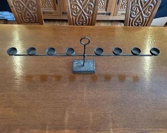 This dining set was purchased in the early 1950s by our homeowner's in-laws. It was hand carved in Brittany, France by master carpenters.  Truly unique and a show-stopper!  The seats are woven in leather! 
