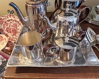 This is a Unique Leather Handled Tea and Coffee Service in Silverplate 