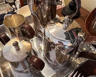 This is a Unique Leather Handled Tea and Coffee Service in Silverplate 