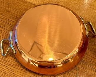 A ton of copper pots and pans, made in France,  perfect for cooking or displaying - they are quite beautiful!