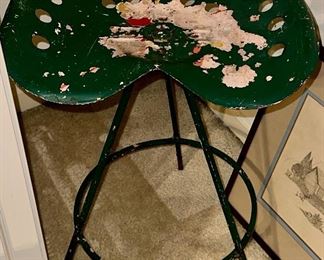 This is a Vintage Tractor Seat Stool on Metal Frame