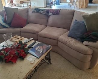 Comfortable curved 4 seat sofa (comes apart at the center to move)