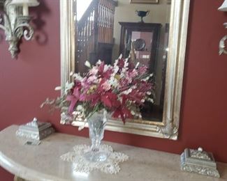 Beveled mirror in the foyer is approx 3' x 2.5'  *** Wall sconces stay with the home and are hard wired***