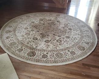 The entrance foyer rug is 9' round.
