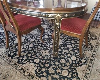 The table is graced with motifs surrounding the table skirting and legs (2 leaves) (2) Captains chairs (6) side chairs...ALL in excellent condition