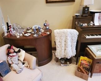 The desk in the back is not part of the sale. The crocheted spread/chair/doll/piano etc are.