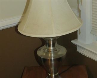 A PAIR OF STAINLESS STEEL LAMPS.