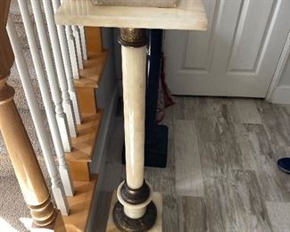 Marble sculpture stand $180 - there are 2, one is cream colored one is black
