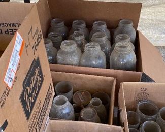 We have many boxes of canning jars, pop bottles etc