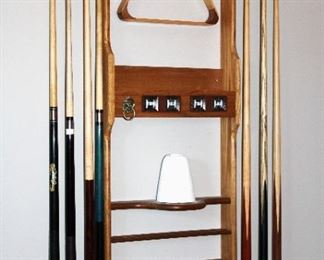 Wall mounted cue and accessory rack.