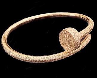 4e4. Cartier style rose gold and diamond nail bracelet